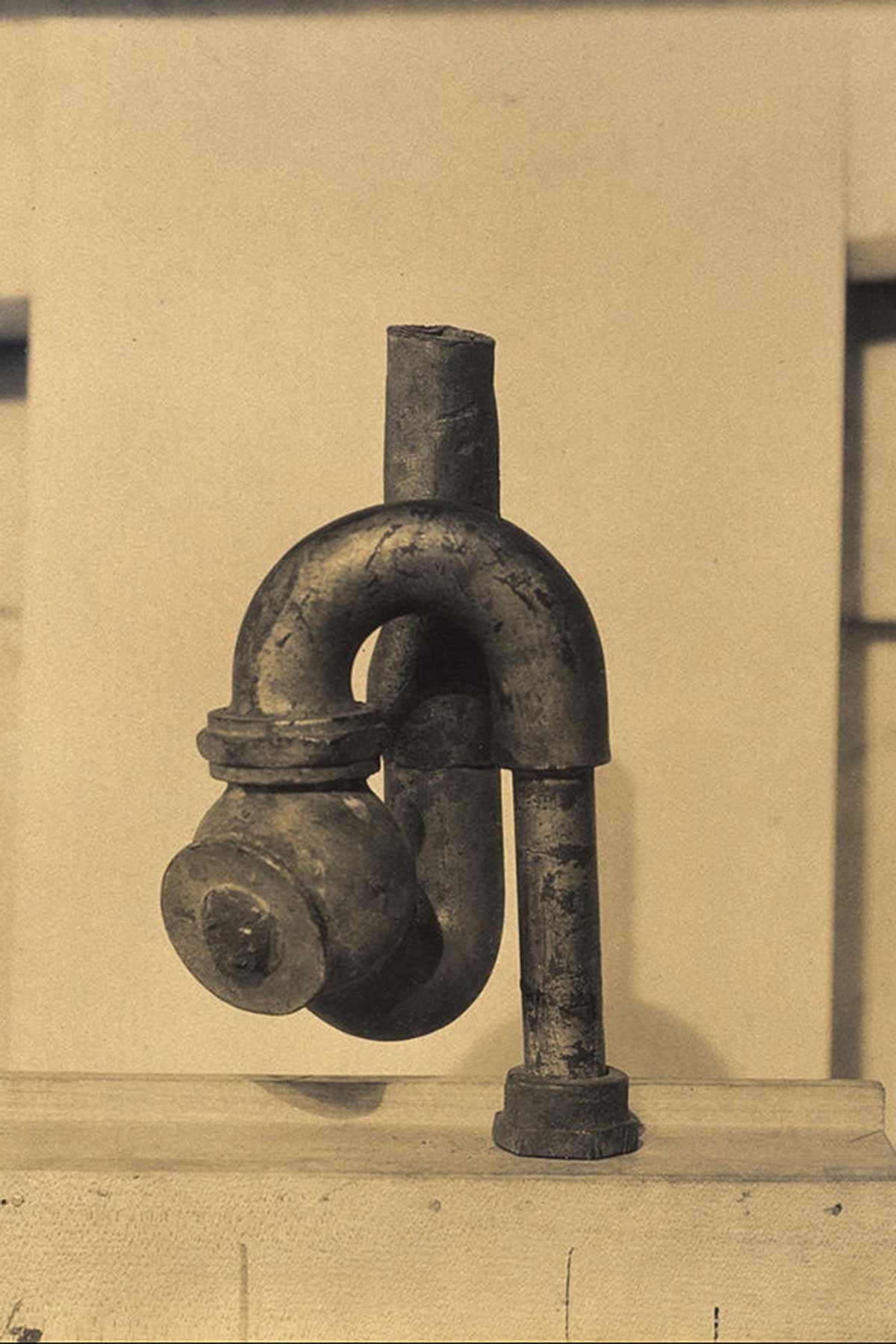 Dada sculpture of plumbing.